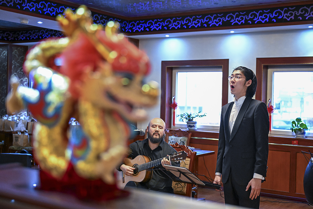 Image of young Chinese man singing.